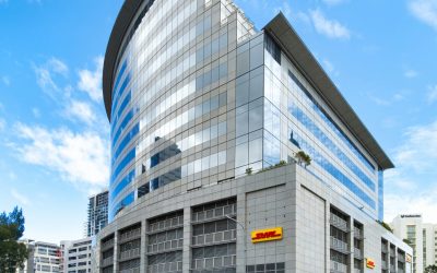 A sleek, modern glass building in Cape Town, showcasing contemporary architecture and urban landscape.